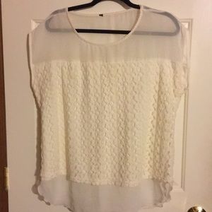 Cream colored blouse.